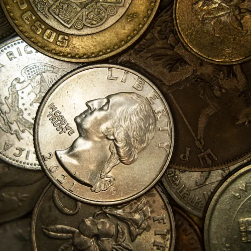 a-heap-of-world-coins-closeup-grunge-financial-ba-2025-02-10-07-54-27-utc.webp